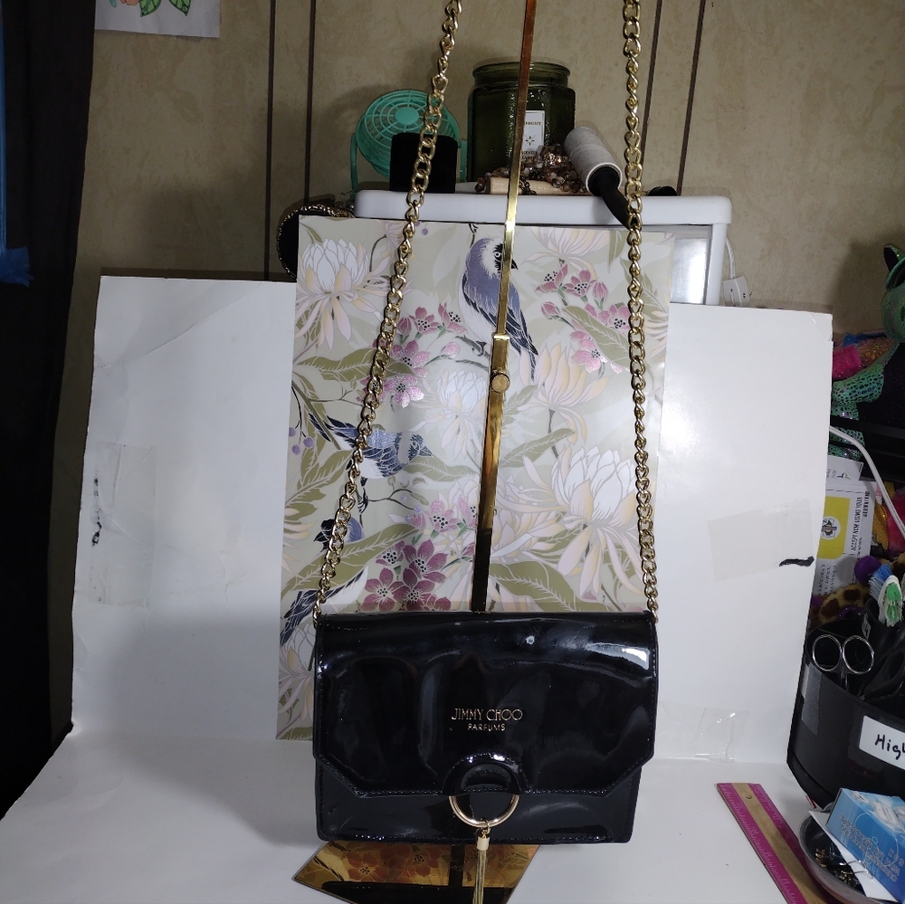 Jimmy Choo Glossy Black Crossbody Bag with Gold Chain